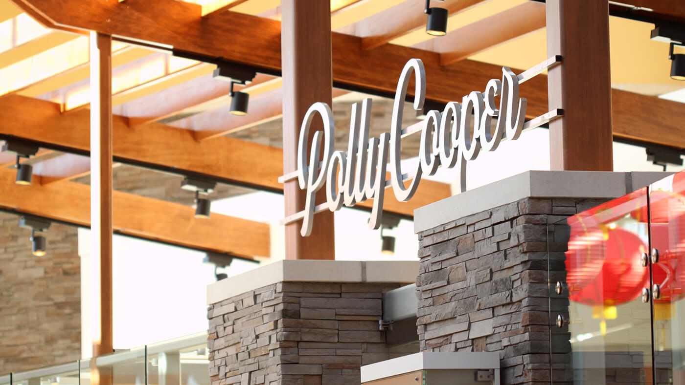 Polly Cooper signage with wood beams