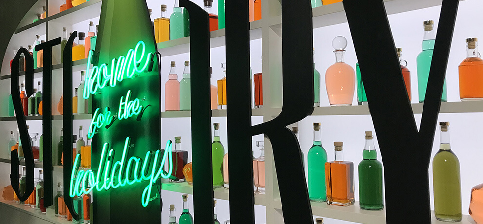 a shop called Story with a color display of bottles