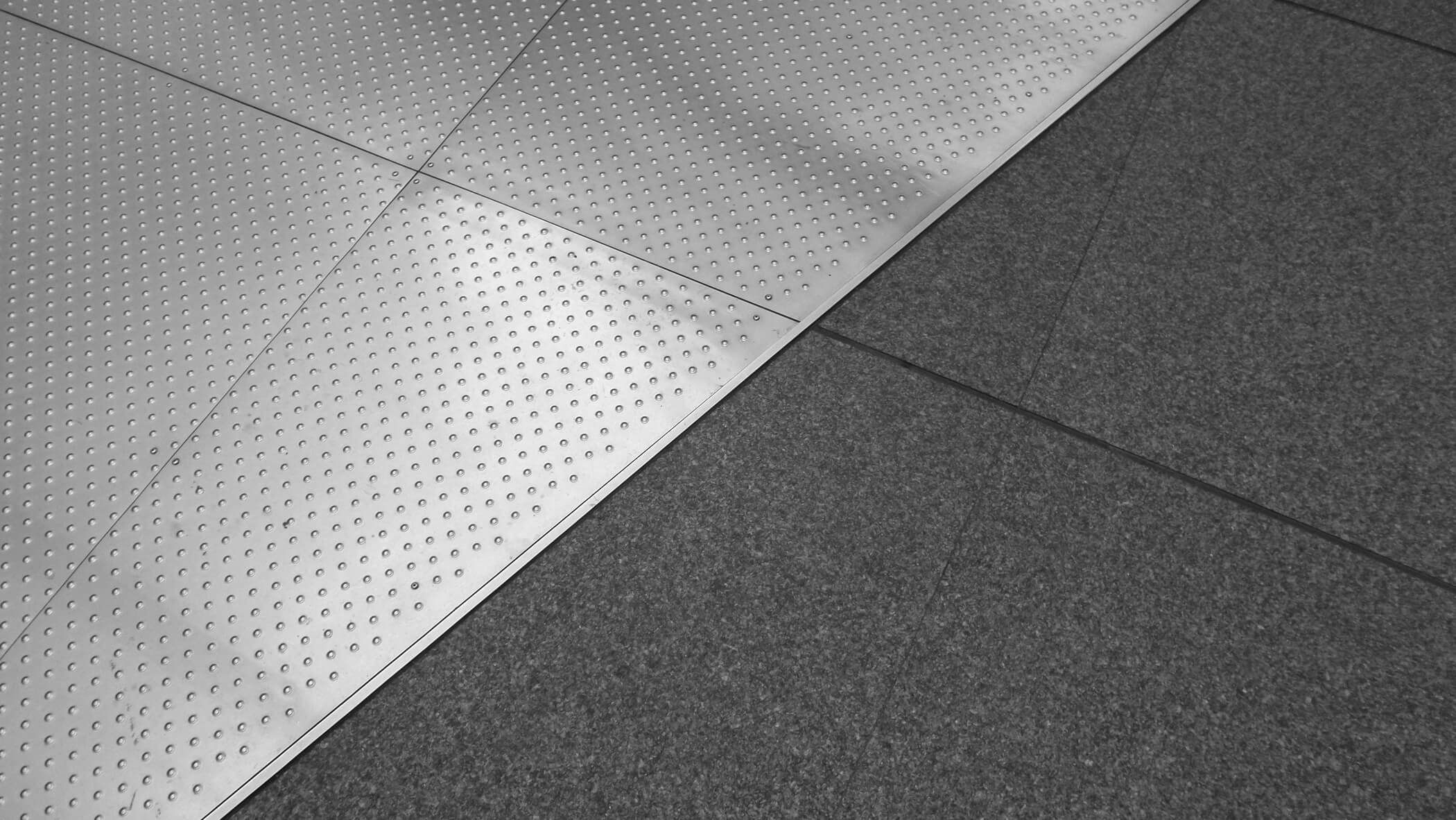 a diagonal split between two flooring textures