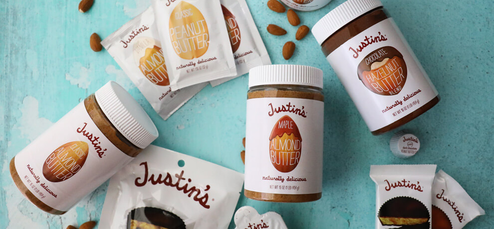 a collection of justin's nut butter jars