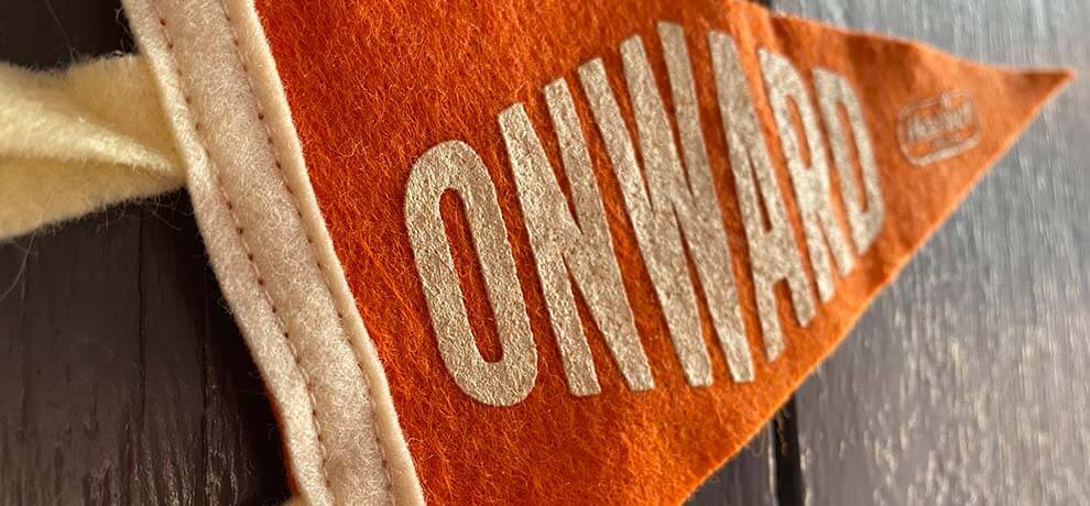an orange pennant that says ONWARD