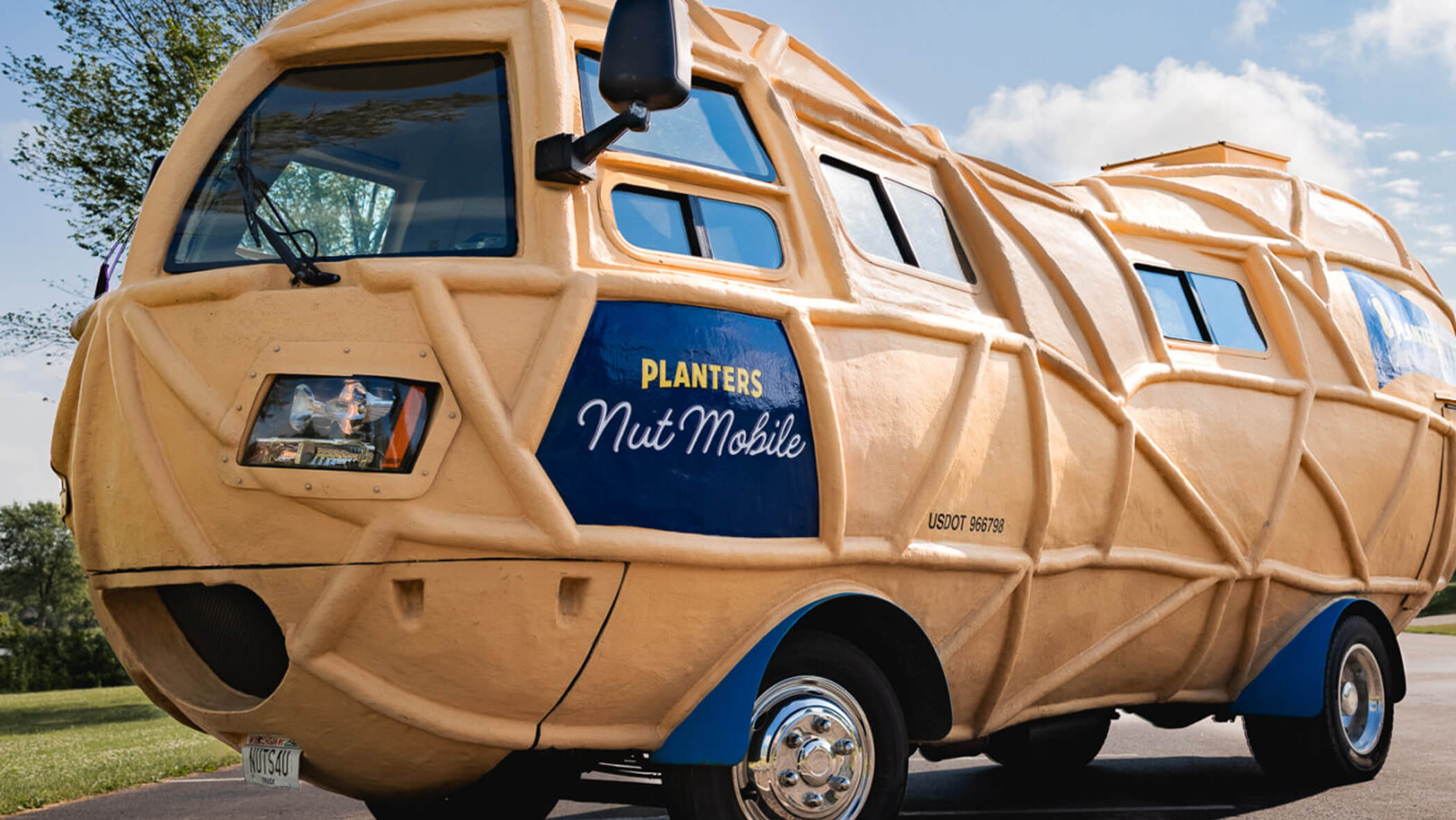 the Planters Nutmobile parked on the side of a road