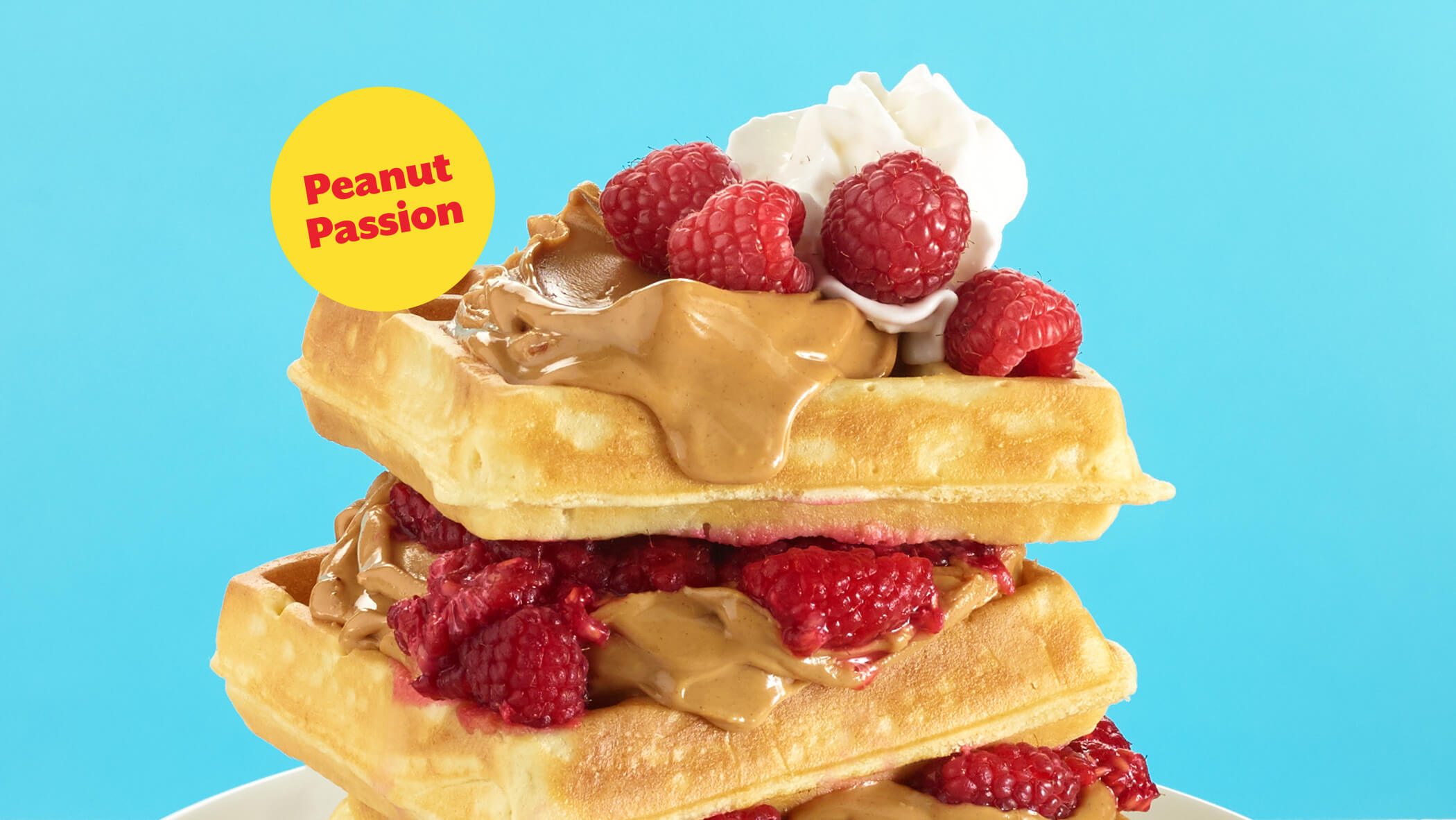 waffles with dripping peanut butter and peanut passion accent