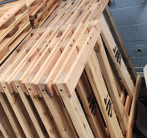 a stack of wooden headboards
