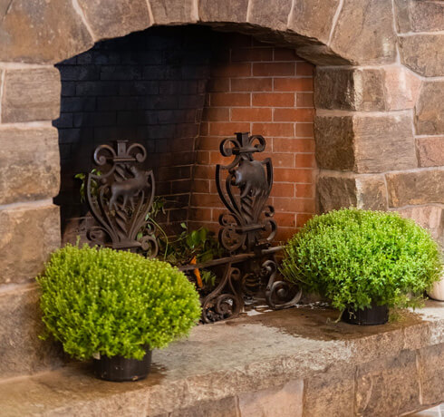 hearth at Whiteface Lodge with green plants